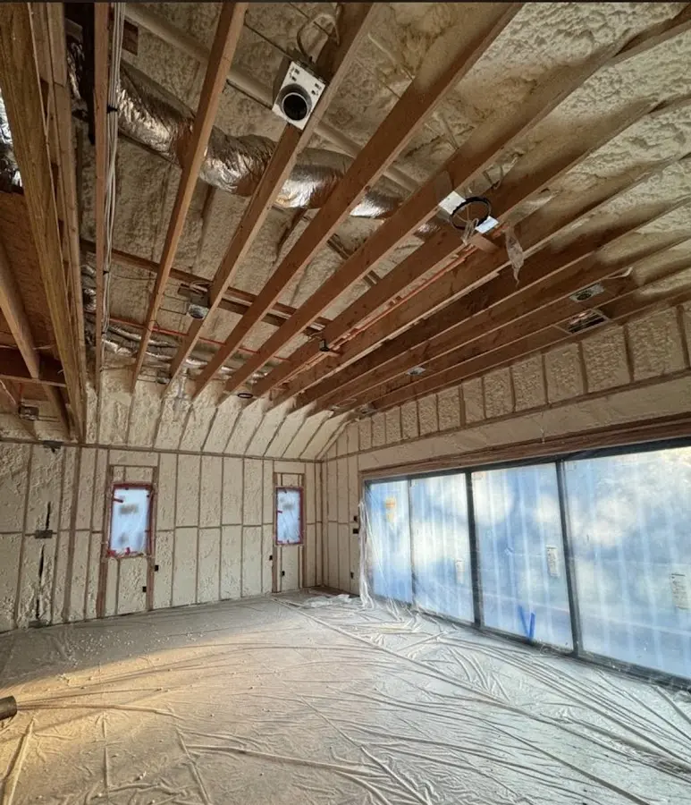 Interior walls and ceiling insulated with spray foam during new construction in Pleasantville